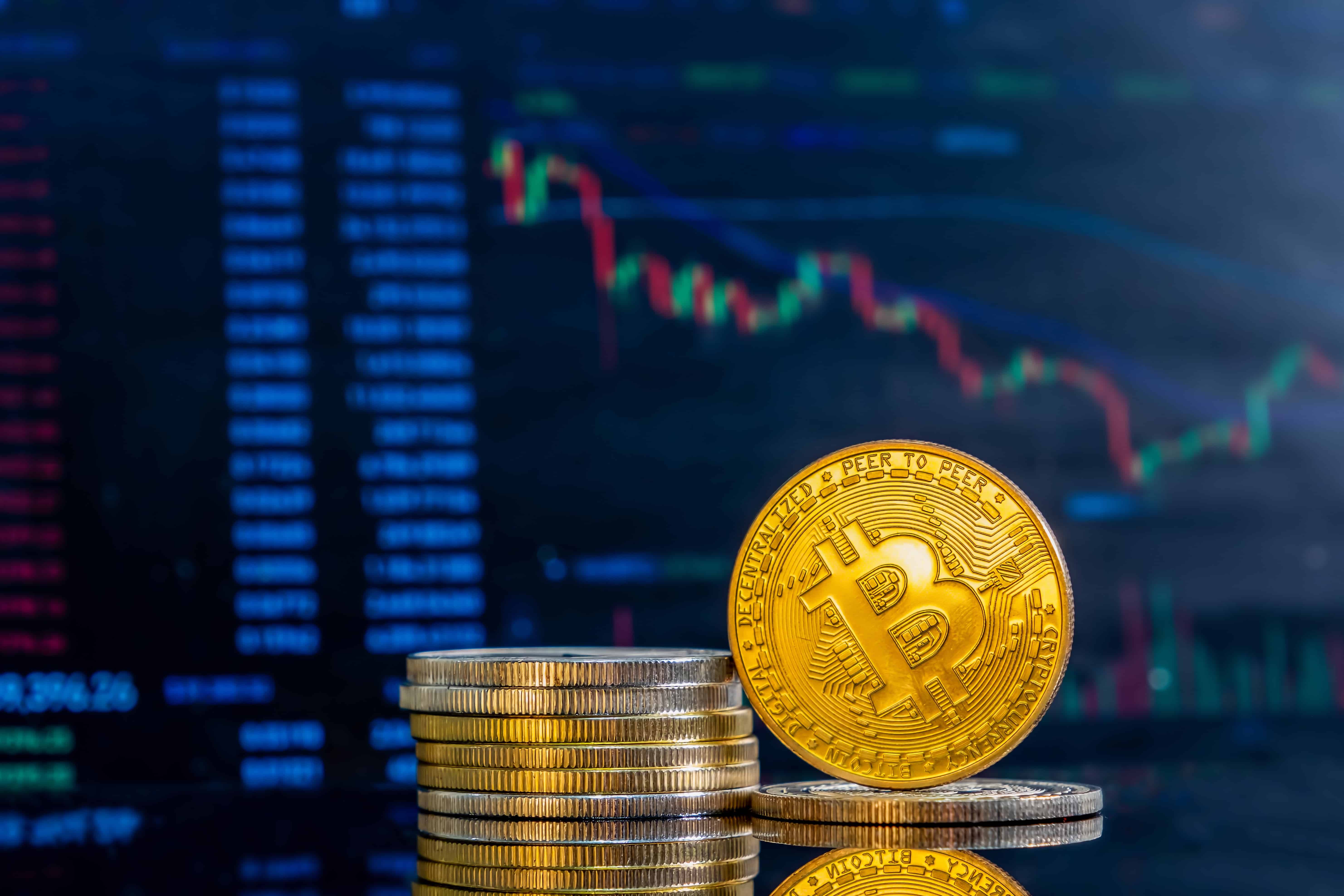 closeup-golden-bitcoins-dark-reflective-surface-histogram-decreasing-crypto-min-min