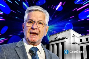 Chris Waller image while speaking on blockchain with Federal Reserve building in background