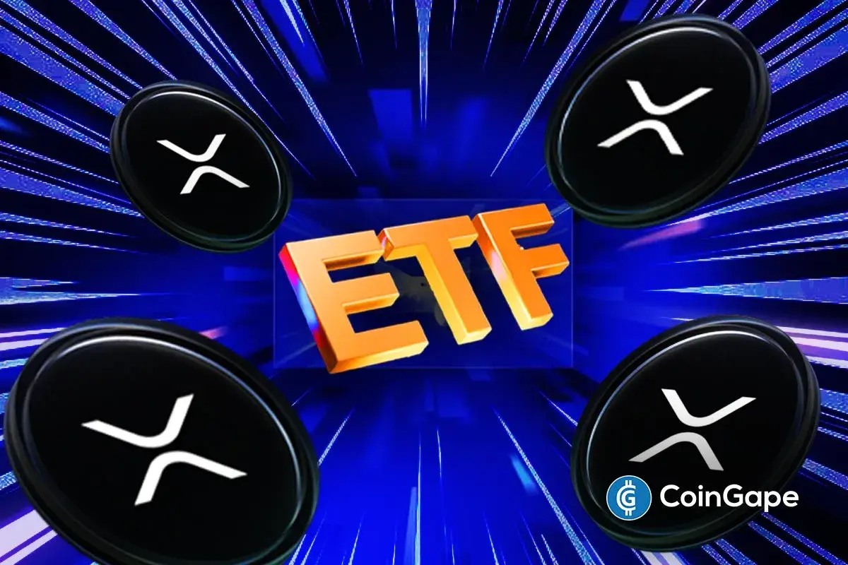 Analyst highlights XRP’s descending triangle pattern while ETF approval faces new regulatory hurdles.