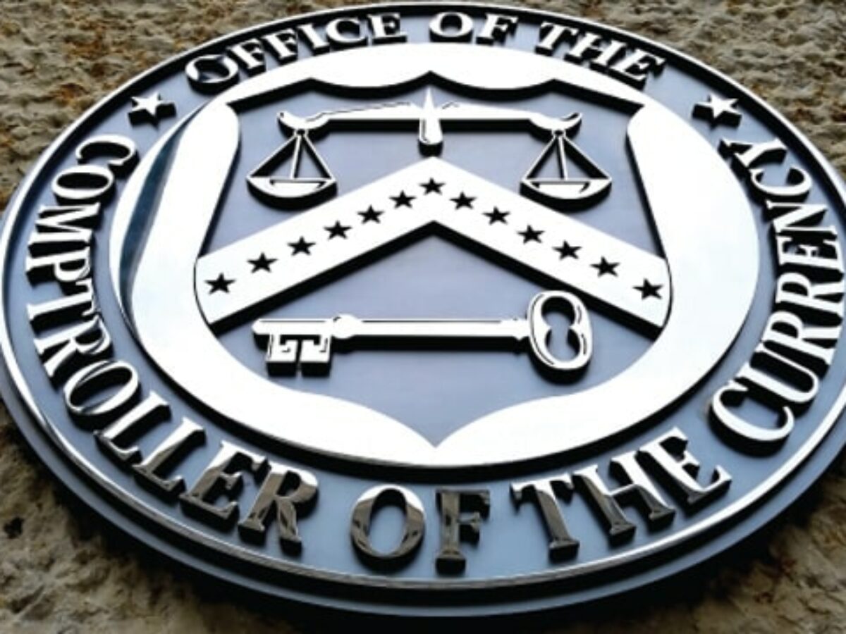 OCC emblem on federal building, representing new regulatory approval for banks to hold crypto assets.