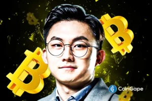 CryptoQuant CEO Ki Young Ju pictured with floating Bitcoin symbols, highlighting his analysis of Bitcoin’s market resilience.