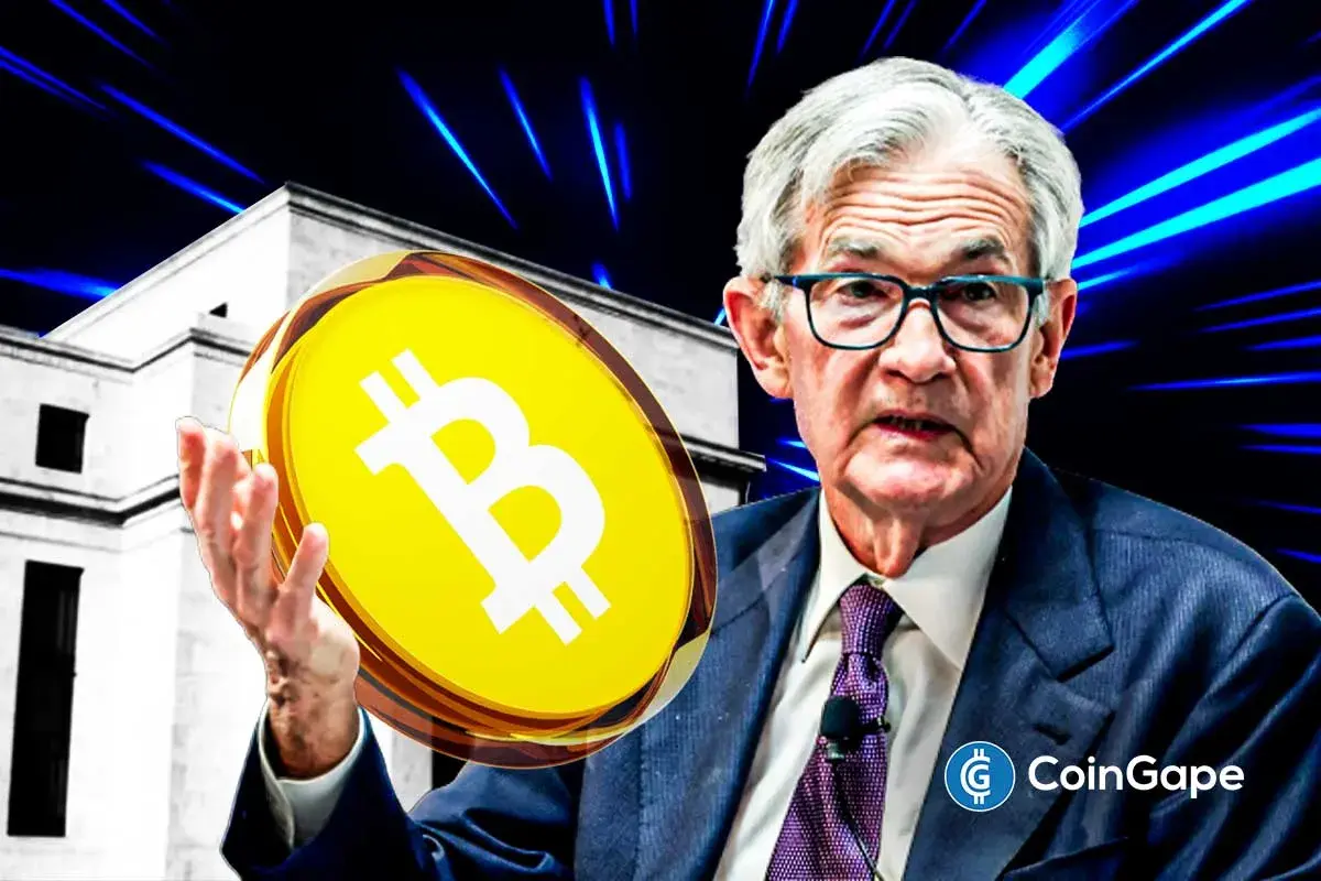 Federal Reserve Chair Jerome Powell addresses an audience as markets react to his latest speech.