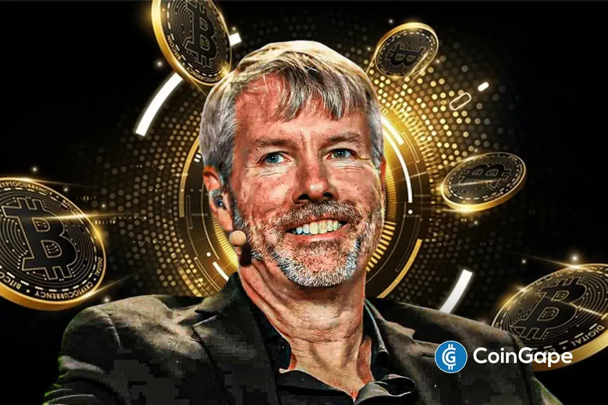 Strategy Chairman Michael Saylor beside a large Bitcoin symbol with Strategy branding in the background, highlighting fresh interest in BTC purchase.