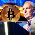 Peter Schiff speaks as Bitcoin and gold appear on screen, highlighting his criticism of crypto as a global reserve asset.