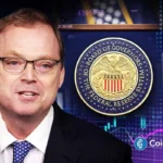 Kevin Hassett appears with Federal Reserve seal and rising market chart as Fed chair race shifts toward Wall Street.